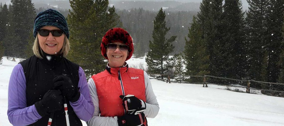 Two girls on a fitness vacation skiing