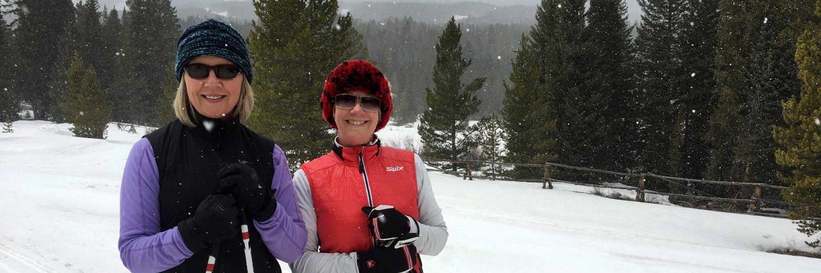 Two girls on a fitness vacation skiing